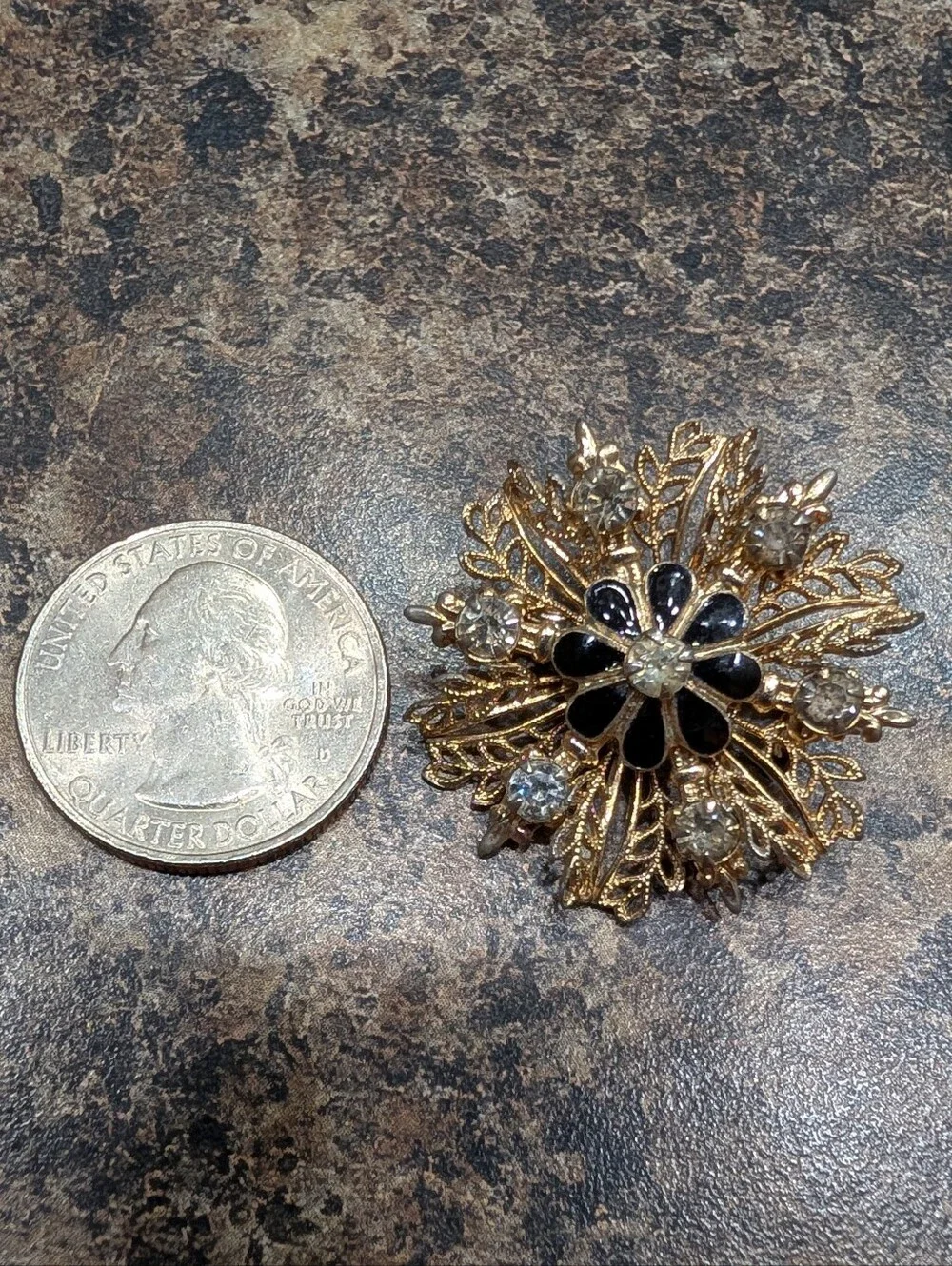 Gold-Tone Filigree Floral Starburst Brooch with Black Enamel and Clear Crystals